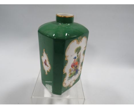 A hand panted Royal Worcester jar, signed G. Johnson (George Johnson), decorated with an exotic bird and butterflies on a gre