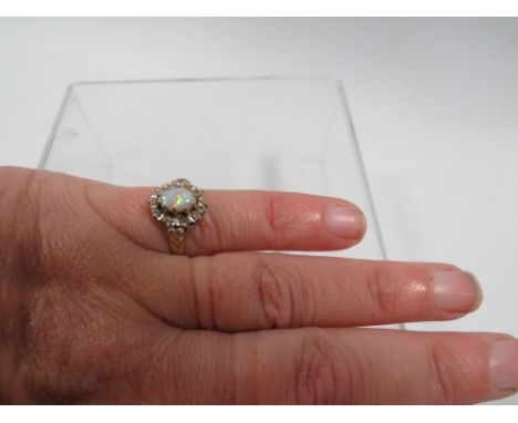 A hallmarked 9 carat gold opal and diamond ring approx. weight 1.9g 