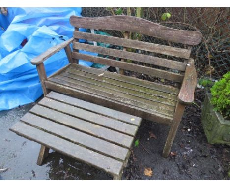 A wooden garden bench and table 