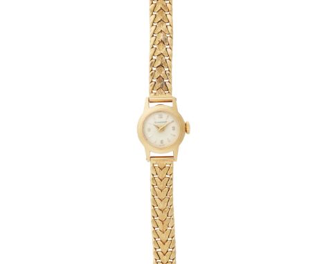 A lady's mid-20th century gold cased wrist watch, Jaeger LeCoultreoff white small dial, baton indicators, plain case, the bra