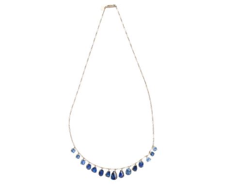 A sapphire set necklaceclaw set with alternating graduated round, cushion and pear shaped sapphire pendants, to a fancy link 