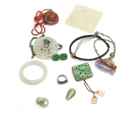 A collection of jade jewelleryto include a square pierced and carved jade panel, a brooch with rectangular carved jade panel 