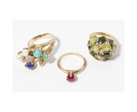 A collection of three gem set ringsto include a 1970s multi-gem set cluster ring, to a textured shank, unmarked; a single sto