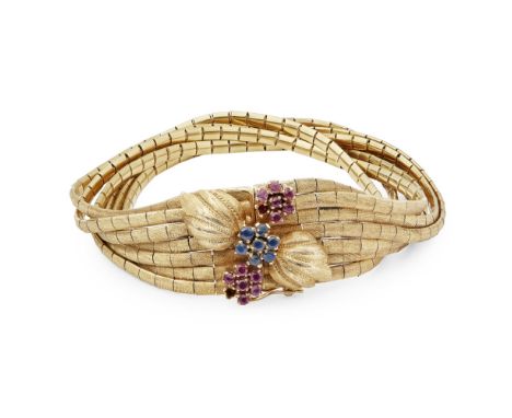 A mid 20th-century ruby and diamond set braceletcomposed of seven strands of textured links, the clasp with foliate detail, s