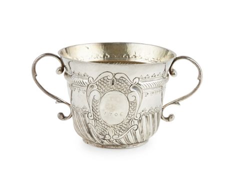 A good Queen Anne porringerJohn Cory, London 1705, of typical form, punch work and chased decoration, plain scroll handles, t