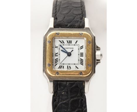 A lady's gold and stainless-steel wrist watch, CartierSantos, stainless steel body, gold bezel, white dial with Roman numeral