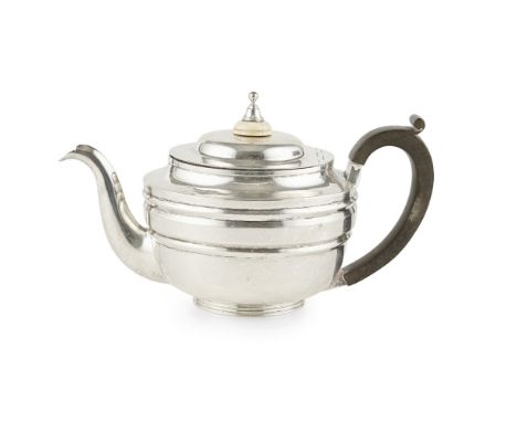 A George III teapotSamuel Hennell, London 1804, of round form, slight stepped border, engraved crest, plain spout, turned fin