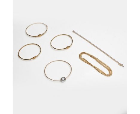 A collection of 9ct jewellerytwo 9ct gold Claddagh bangles, and another unmarked; a 14ct bangle set with a single Tahitian pe