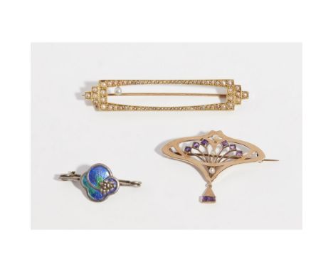 Three gem set broochesto include an Art Nouveau amethyst and pearl set brooch, stamped 585; a rectangular seed pearl set broo