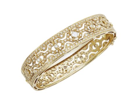 A diamond set bangleof hinged design with pierced geometric detail, set throughout with eight-cut diamonds, collet set with l