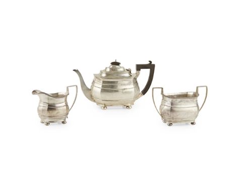 A three piece tea serviceNathan and Hayes, Chester 1914, of rounded slight panelled form, angular handles, plain and raised o