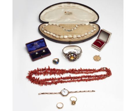 A collection of jewelleryto include a 1912 sovereign in a detachable mount, a 9ct gold buckle ring; three further gem set rin