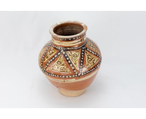 An Islamic Samanid Pottery Jar from the 10-11th Century Decorated with Enamel Work.H: Approximately 22cm 