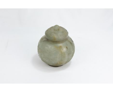 An Indian Mughal Style Jade Sugar Pot with a Lid Decorated with Floral Patterned Carvings.H: Approximately 12cm 
