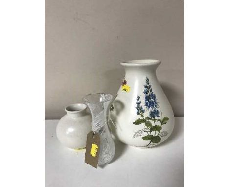 Two Poole pottery vases together with a Caithness vase