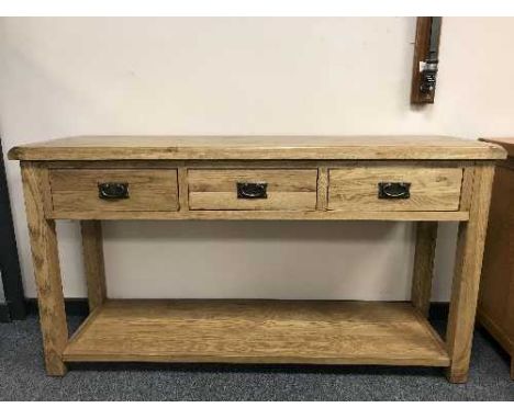 A light oak three-drawer dresser