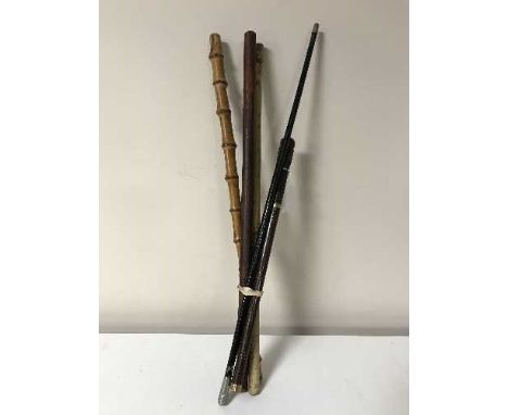 Four swagger sticks and a small rosewood sword stick