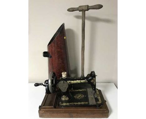 A Singer hand sewing machine in mahogany case, coal receiver and a poss stick 