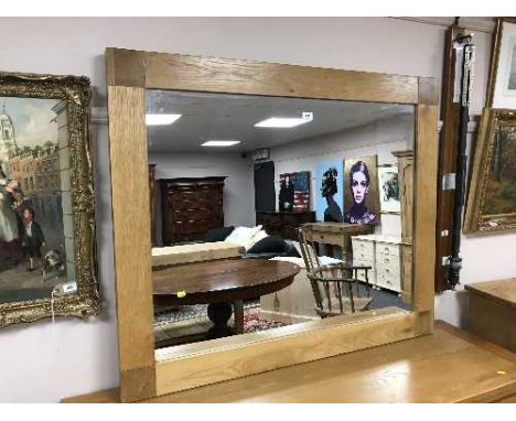 A light oak overmantel mirror