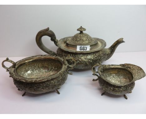 SCOTTISH SILVER TEA SERVICE, Victorian HM silver 3 piece oval bodied tea service with ornate floral and scroll embossing by E