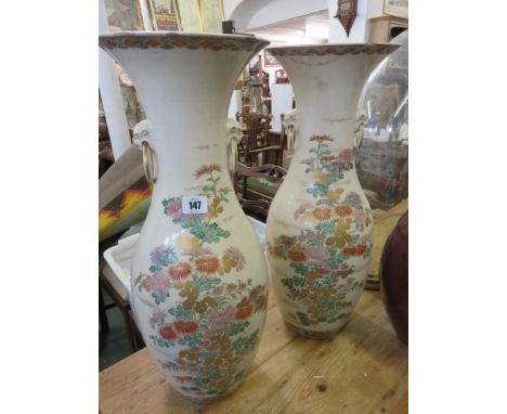 SATSUMA, an impressive pair of Satsuma pottery 21.5" vases, gilded Chrysanthemum blossom designs with twin ring drop handles 