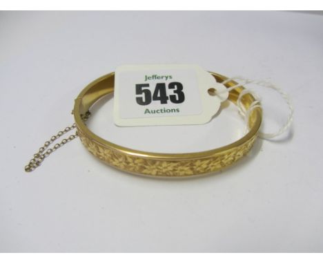 GOLD BANGLE, 9ct gold hinged bangle with foliate engraved decoration 8.5 grams 