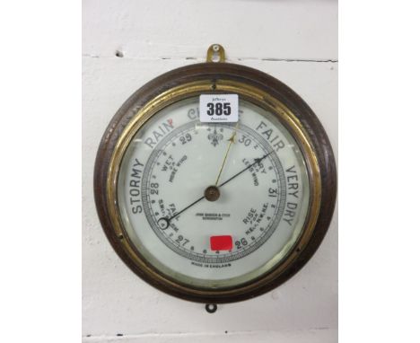 SHIP'S BAROMETER, brass surround circular framed barometer by John Barker