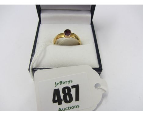 RUBY RING, 22ct yellow gold band ring set an oval ruby size Q, 3.1 grams overall