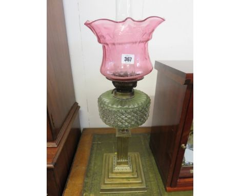 OIL LAMP, brass square based oil lamp with crinoline cranberry shade