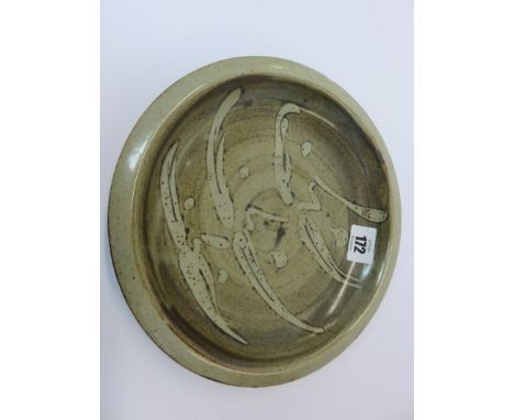 BERNARD LEACH; Leach pottery slipware dish with simple brushwood decoration on a brown ground. Approximately 9" diameter, wit
