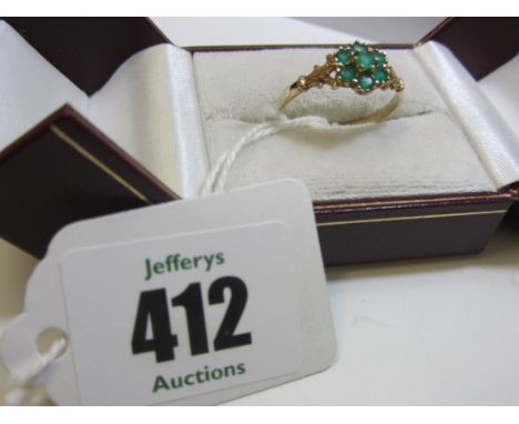 EMERALD RING, 9ct yellow gold ring set a cluster of 7 emeralds. Ring size R/S 