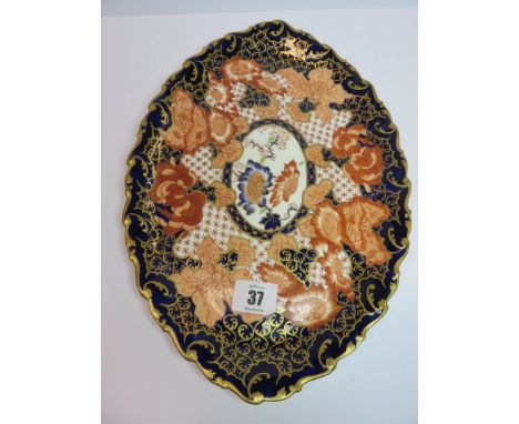 ROYAL CROWN DERBY, a gilded and floral pattern shaped oval cabaret tray