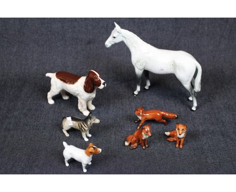 Collection of Beswick figurines inc Dapple Grey Horse, Spaniel, Terrier, Alsatian and 3 Foxes. Condition - some light chippin