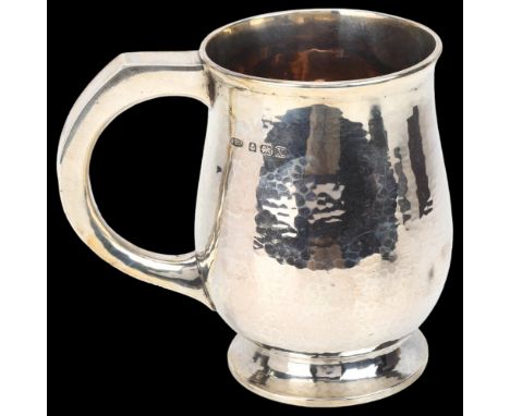 An Edward VIII silver pint mug, Albert Edward Jones, Birmingham 1936, baluster form with planished decoration, height 12cm, 9