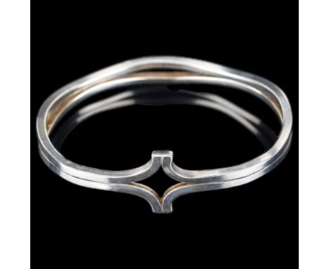 A large Danish modernist sterling silver openwork bangle, unsigned, setting height 25.3mm, internal circumference 20cm, 40.3g