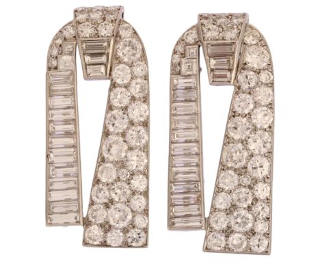 CARTIER - a pair of Art Deco platinum diamond dress clips, circa 1930s, geometric form, each set with graduated round brillia