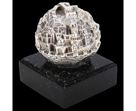 An Israeli silver Old City of Jerusalem ball sculpture, Sam Philipse, circa 1990s, on speckled base, overall height 9cmNo dam