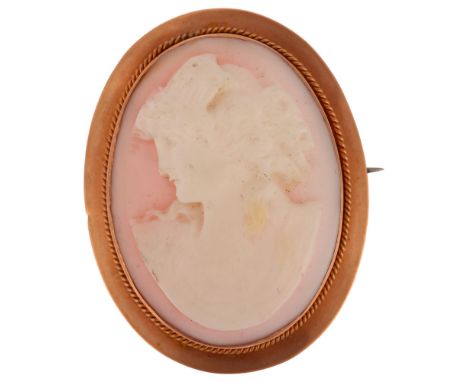 A 19th century pink coral cameo brooch, relief carved depicting a female profile, in 9ct rose gold frame, brooch height 42mm,