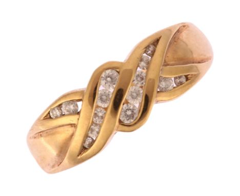 A modern 9ct gold cubic zirconia crossover band ring, setting height 6.4mm, size K, 2.2gNo damage or repair, all stones prese