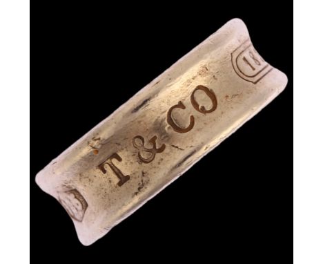 TIFFANY & CO - a sterling silver band ring, London 2006, band width 6.8mm, size K, 6.8gQuite heavily worn, hallmarks clear. 