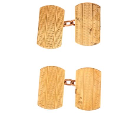 A pair of mid-20th century 9ct gold cufflinks, rounded rectangular form with engine turned decoration, panel length 17.3mm, 3