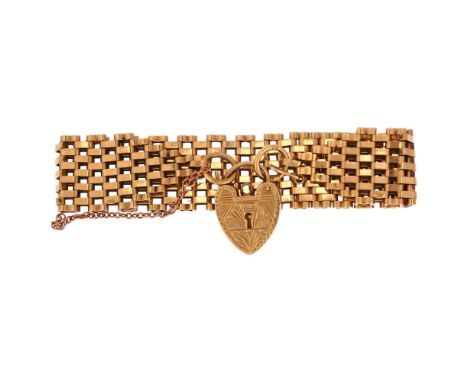 A mid-20th century 9ct gold gatelink bracelet, maker's marks S&K, London 1965, with 9ct engraved heart padlock clasp, length 