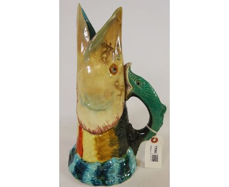 Royal Worcester Majolica tall jug in the form of a pike head rising from the water fish scroll handle, impressed marks to bas