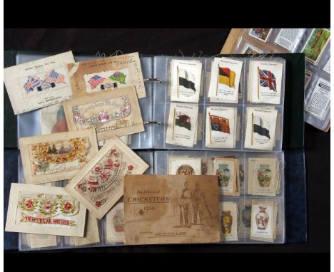 Two albums mainly unmarked cigarette card silks including Flags of the World, 25+ large former flags approx size 4 1/2" x 6",