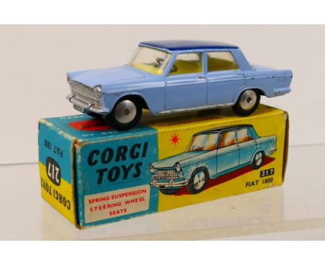 Corgi Toys - A boxed Corgi Toys #217 Fiat 1800. The model with pale blue body and dark blue roof, with lemon interior, has so