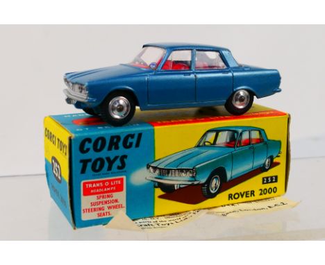 Corgi Toys - A boxed Corgi Toys #252 Rover 2000. The model in metallic light blue with red interior, 'Trans-O-Lite' headlamps