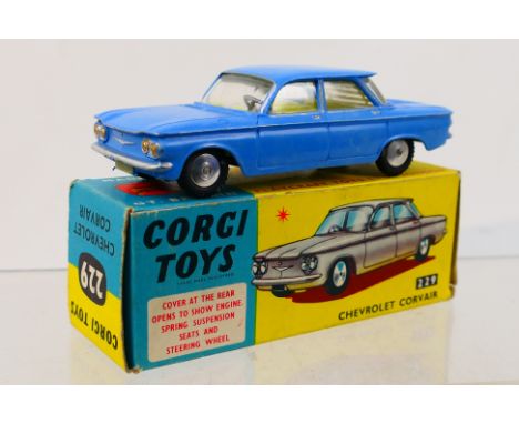 Corgi Toys - A boxed Corgi Toys #229 Chevrolet Corvair. The model in powder blue with lemon interior, Venetian blind to rear 