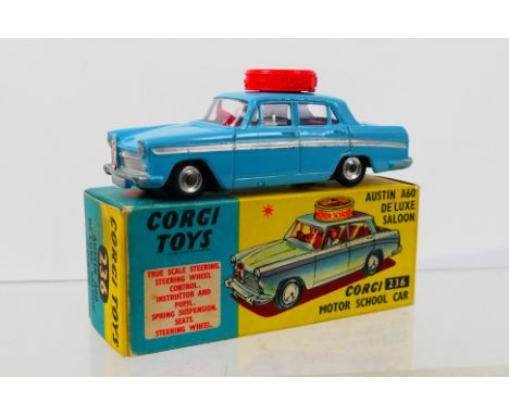 Corgi Toys - A boxed Corgi Toys #236 Corgi Motor School Car. The right hand drive model in light blue, red interior, red roof