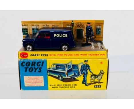 Corgi Toys - A boxed Corgi Toys #448 BMC Mini Police Van with Tracker Dog. The model in dark blue with red interior plus Poli