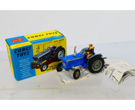 Corgi Toys - A boxed Corgi #67 Ford 5000 Super Major Tractor with blue body, grey hubs and mudguards with silver trim, driver